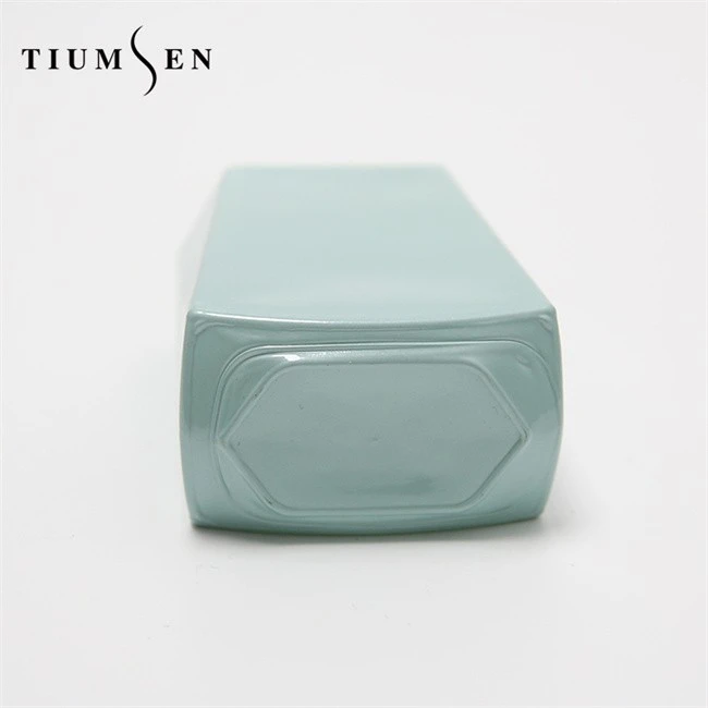 perfume with green cap